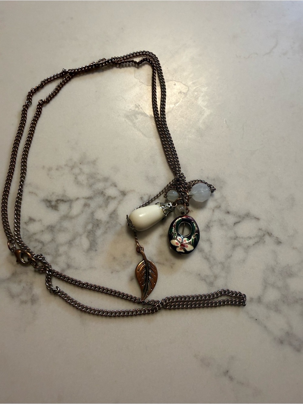 Urban Outfitters Multi-Charm Necklace with White Teardrop and Floral Pendant